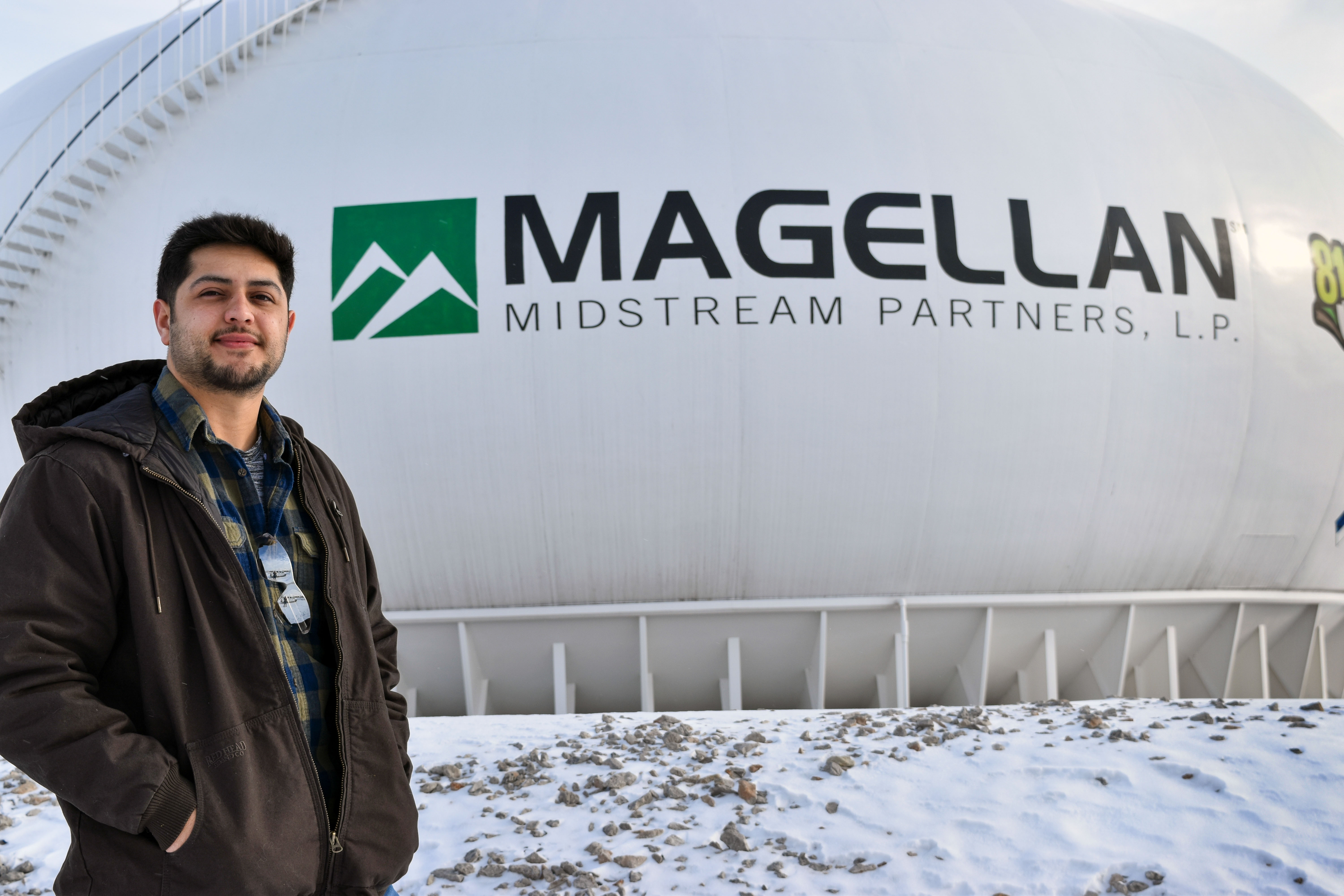 Barton Natural Gas Program alum Sergio Montes poses at his workplace.