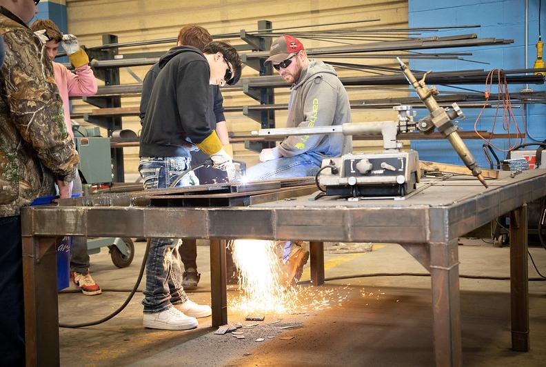 student using a power tool